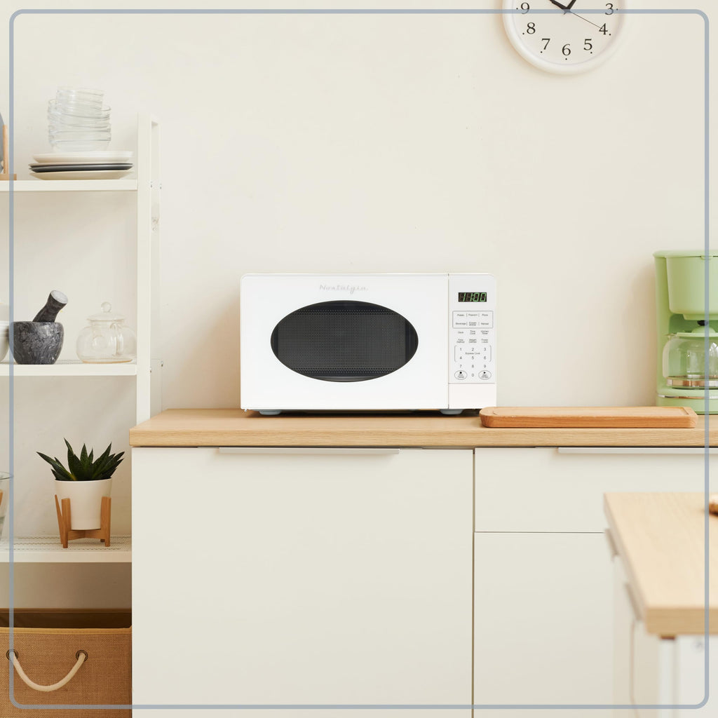 Nostalgia Retro Compact Countertop Microwave Oven 0.7 Cu. Ft. -700-Watts with LED Digital Display-Child Lock-Easy Clean Interior-Pink