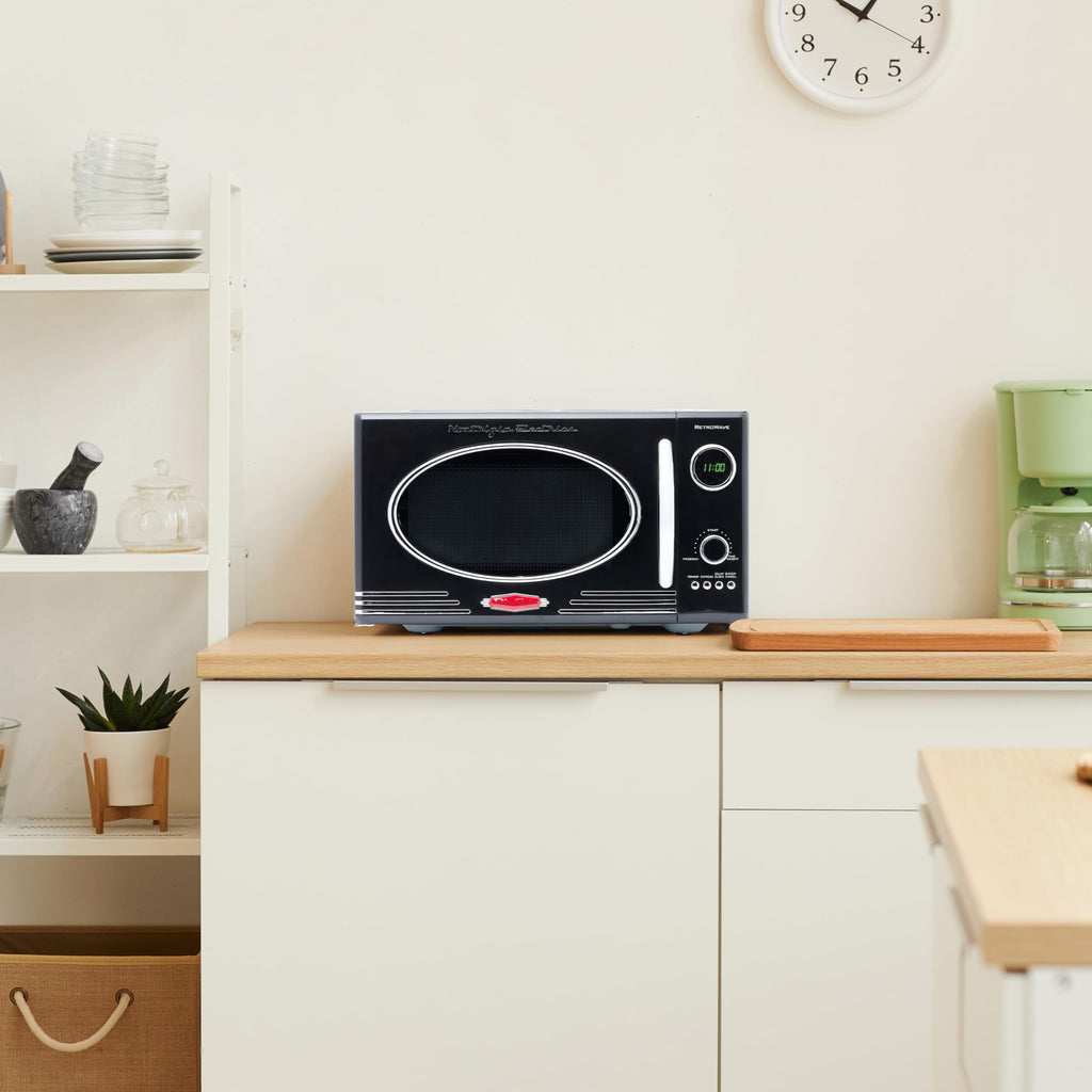 Nostalgia Retro Compact Countertop Microwave Oven 0.7 Cu. Ft. -700-Watts with LED Digital Display-Child Lock-Easy Clean Interior-Pink