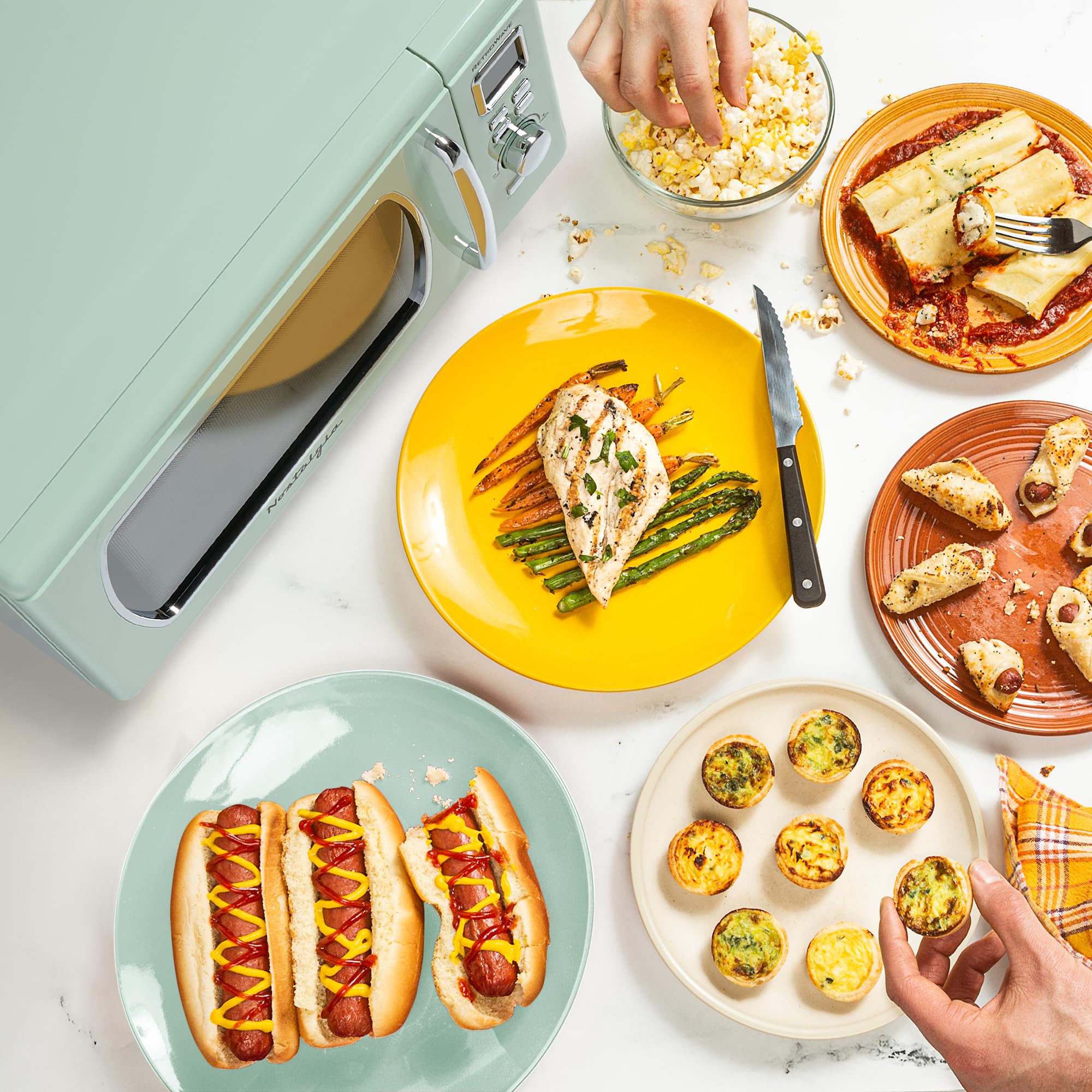 Nostalgia Retro Compact Countertop Microwave Oven 0.7 Cu. Ft. -700-Watts with LED Digital Display-Child Lock-Easy Clean Interior-Pink