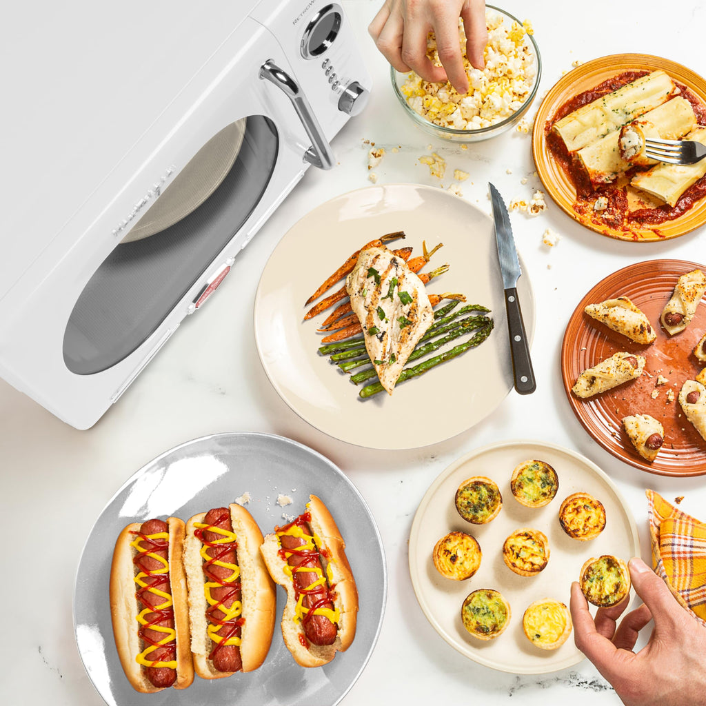 Nostalgia Retro Compact Countertop Microwave Oven 0.7 Cu. Ft. -700-Watts with LED Digital Display-Child Lock-Easy Clean Interior-Pink