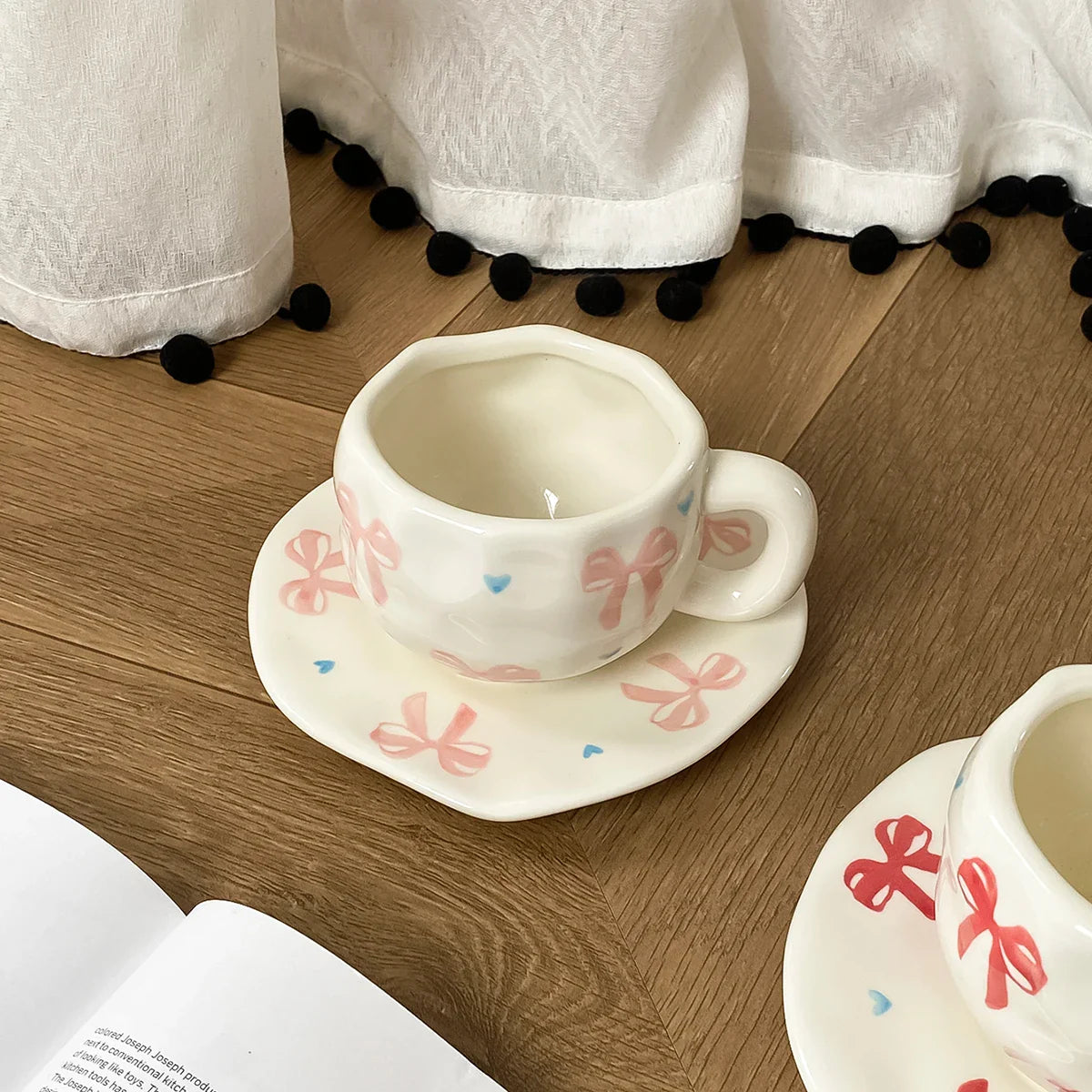 Hand-Kneaded Asymmetrical Bow Tea Cup and Saucer (1 Set)