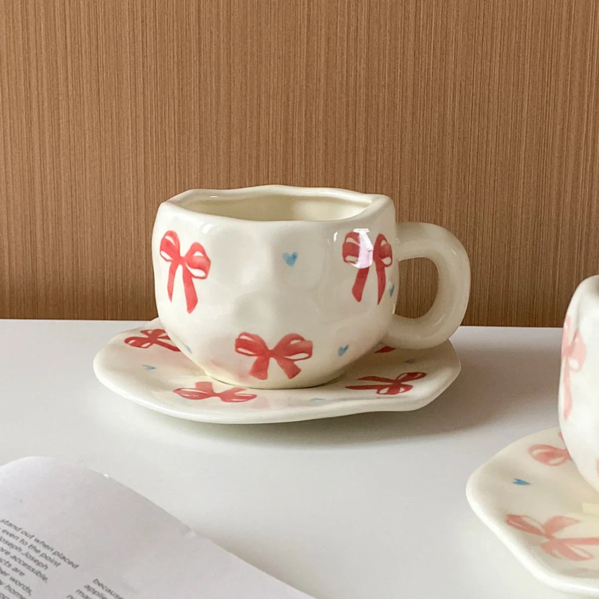 Hand-Kneaded Asymmetrical Bow Tea Cup and Saucer (1 Set)