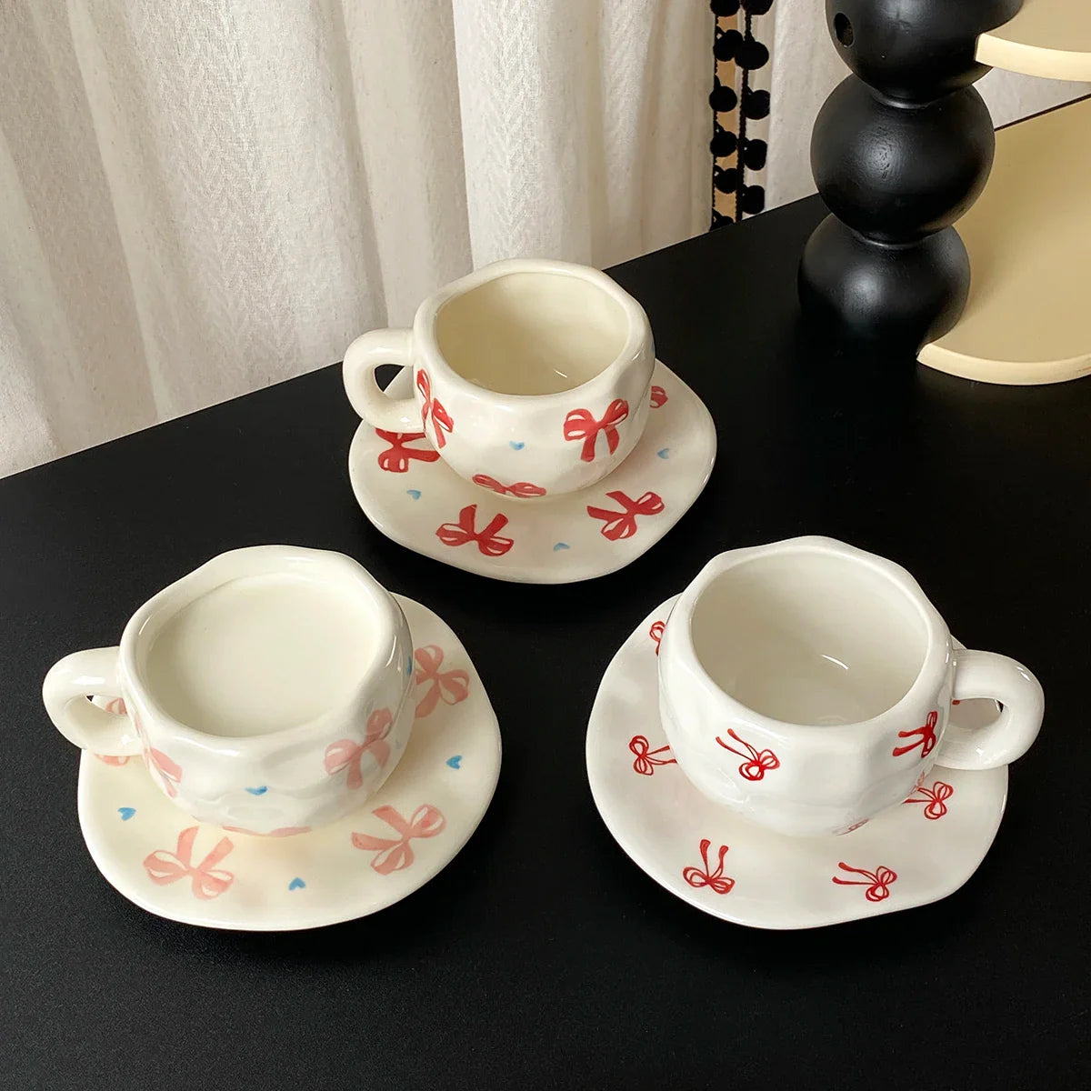 Hand-Kneaded Asymmetrical Bow Tea Cup and Saucer (1 Set)