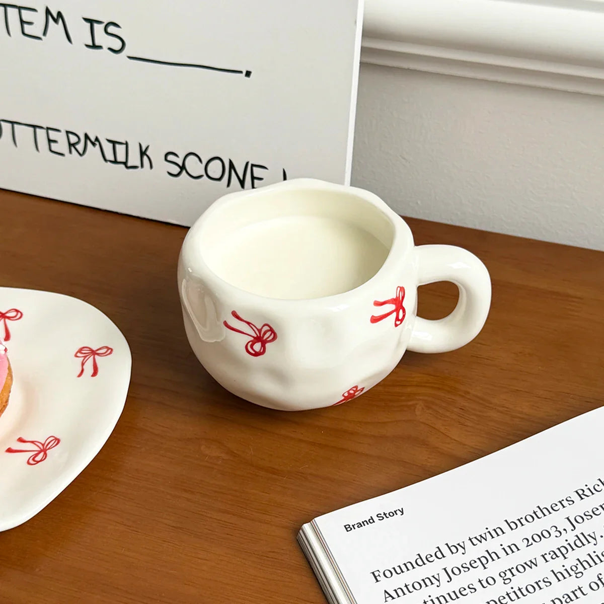 Hand-Kneaded Asymmetrical Bow Tea Cup and Saucer (1 Set)